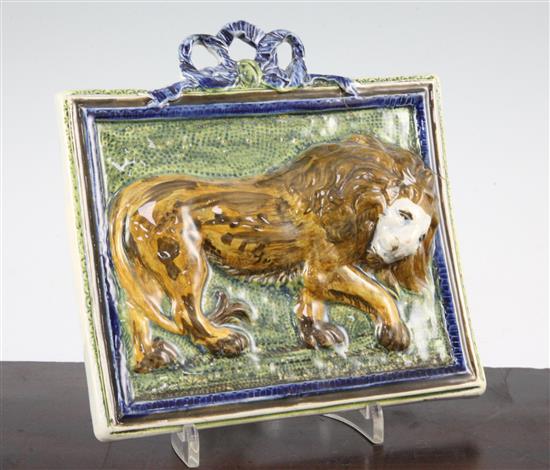 An unusual Pearlware pottery lion plaque, c.1810, 20 x 19.8cm., one corner re-stuck